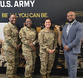 Marketer Victor poses for a picture with recruiters from the Greenville recruiting station Marketer Victor poses for a picture with recruiters from the Greenville recruiting station