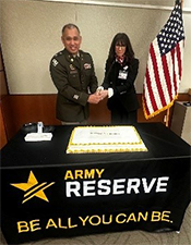 LTC Luna and Ms. Price cutting the cake LTC Luna and Ms. Price cutting the cake